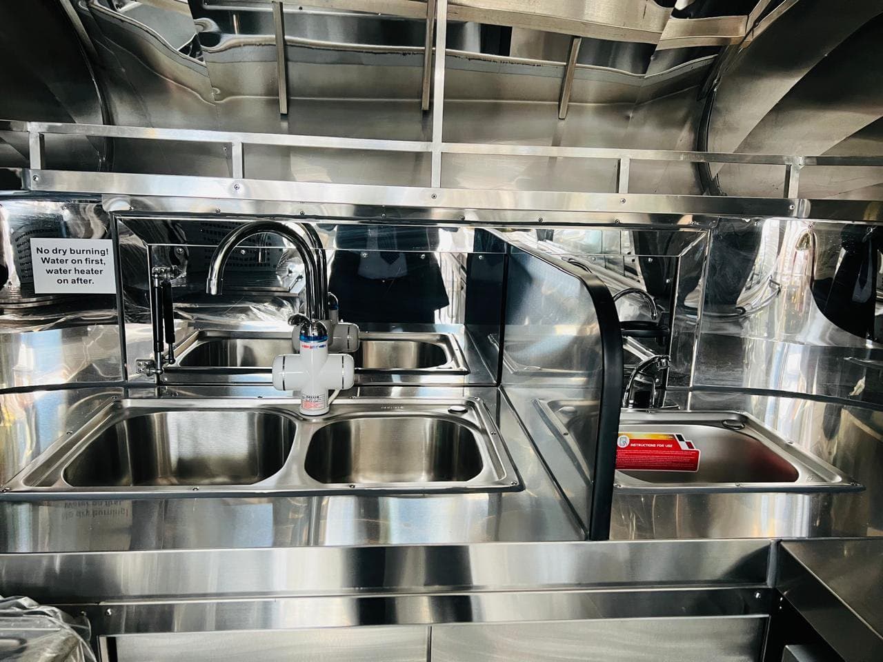 Stainless kitchen interior of a QH mobile unit