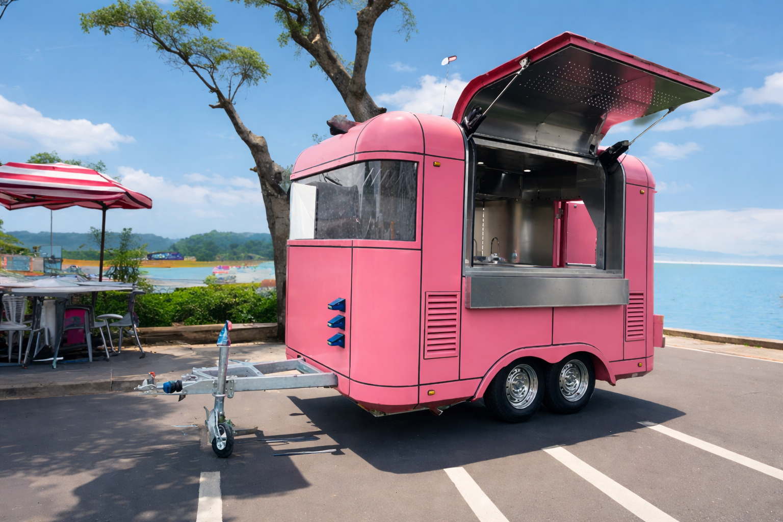 Pink QH concession trailer parked by the water